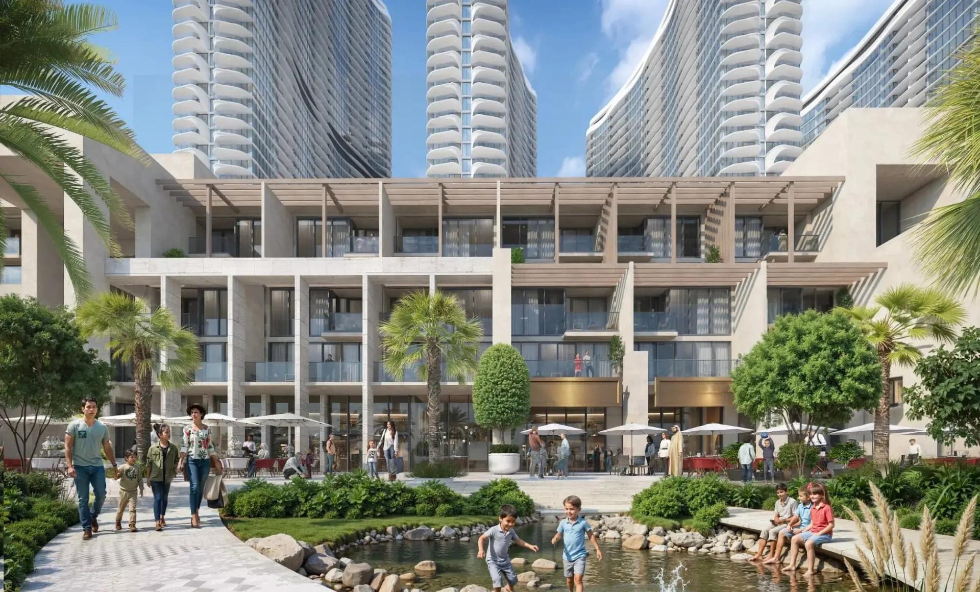 Landscaped courtyard with a stream and pergola-covered podium at the base of the Sobha Aquacrest towers