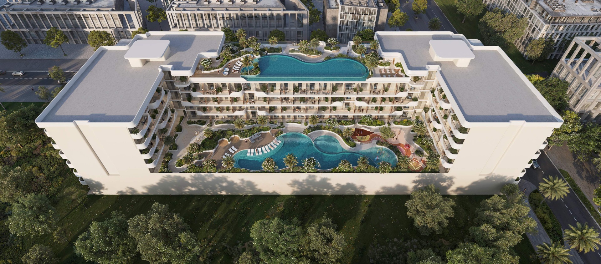 Oxford Cove – letecký pohled na amenity deck s dvěma bazény, zelení a odpočinkovými zónami