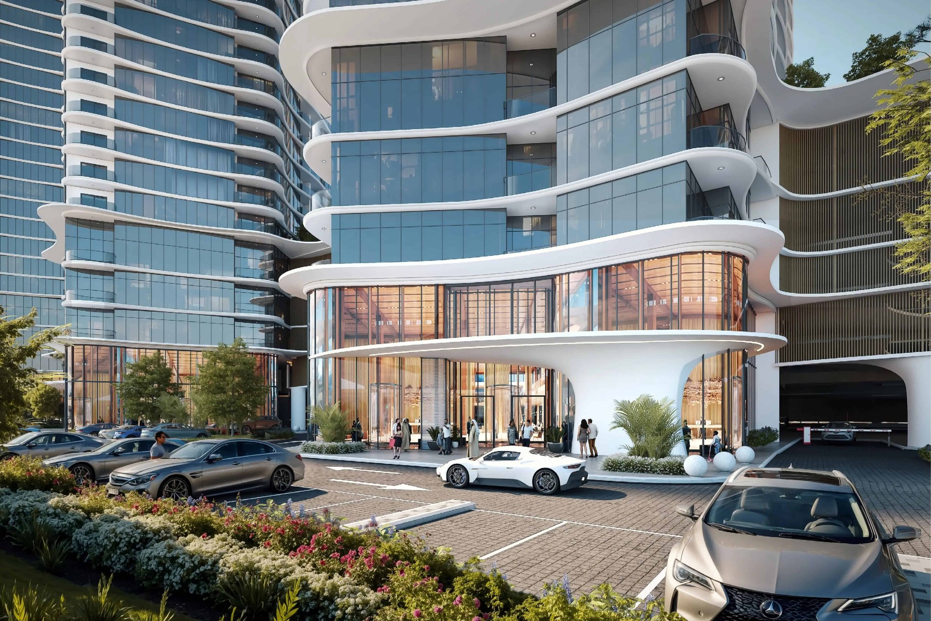 Signature entrance to a Sobha Aquacrest tower with glass lobby, curved canopy and arrival drive