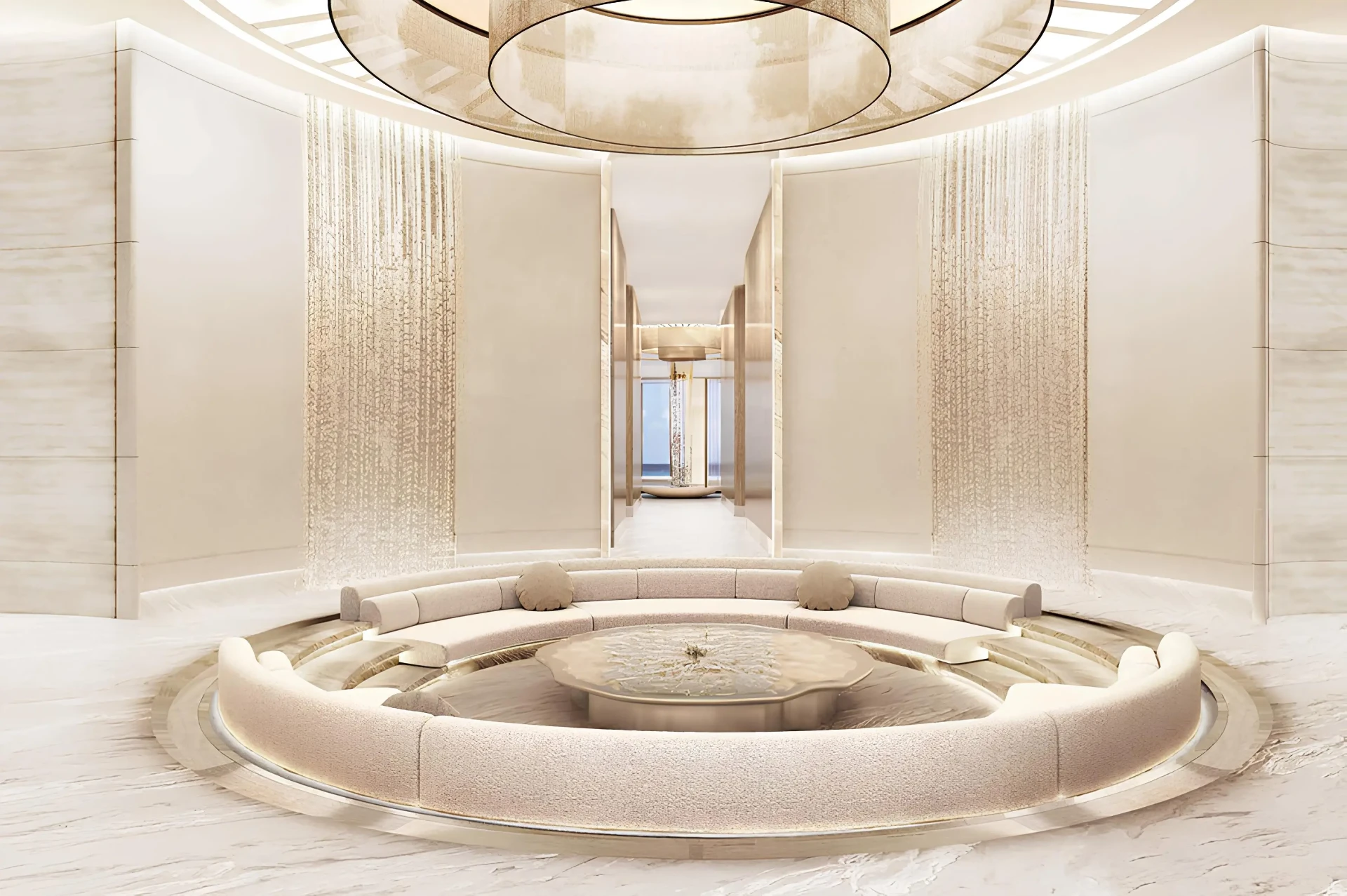 Kruhové recepční lounge AMRA s centrální fontánou a jemným zlatavým osvětlením