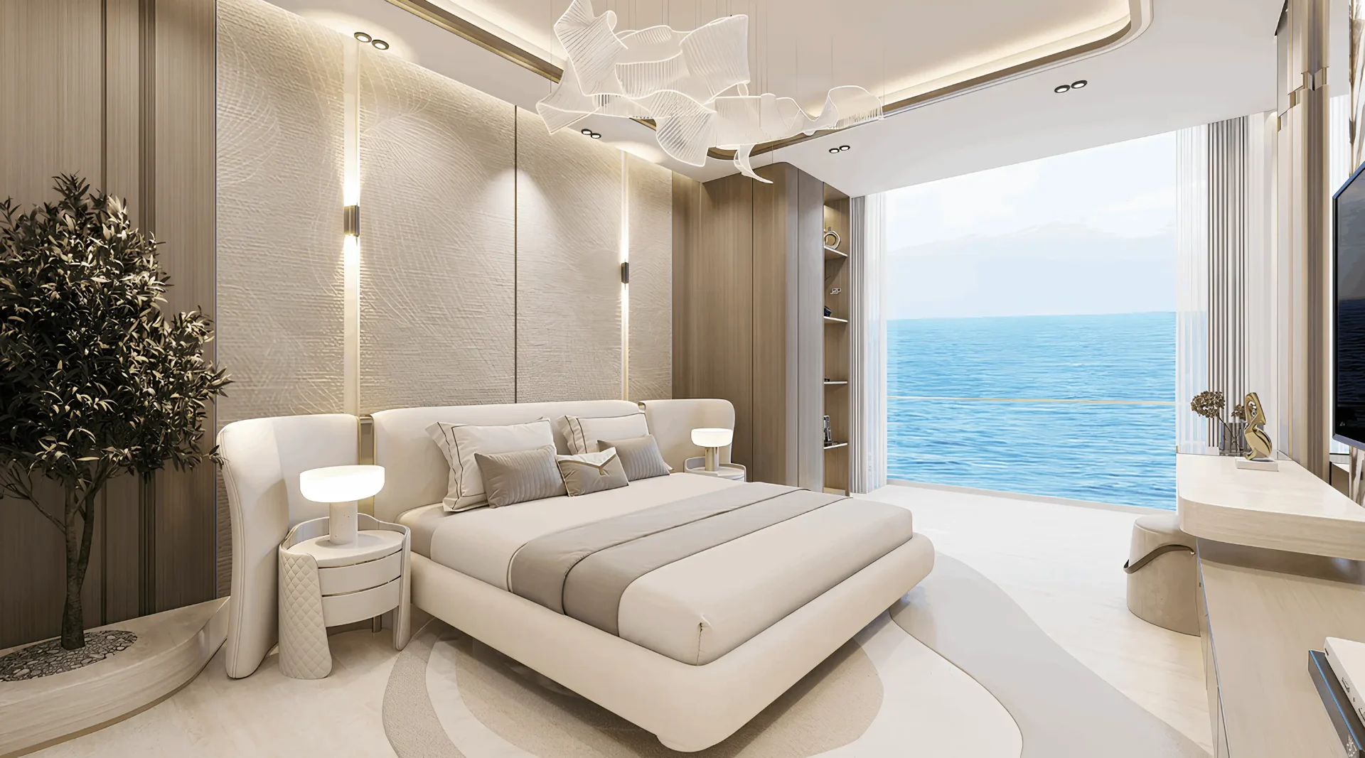 Elegantní ložnice apartmánu Breeze s nábytkem Blanco Luxe, designovým lustrem a panoramatickým výhledem na moře