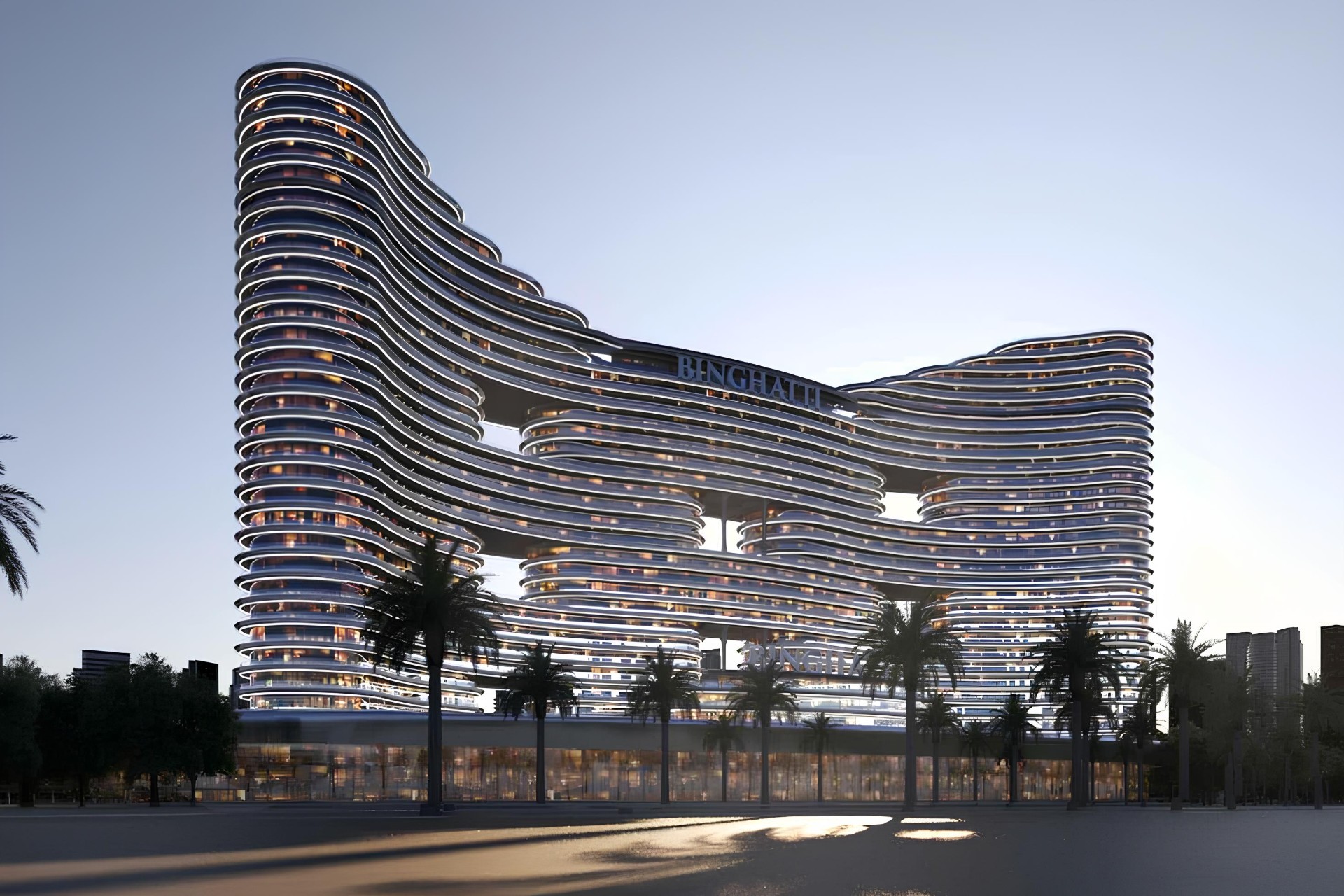 Binghatti Aquarise – exterior of the tower with flowing facade in Business Bay at dusk